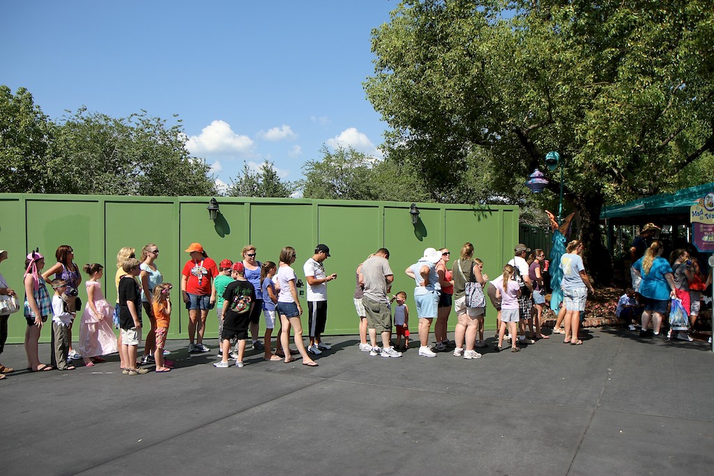 Fantasyland - The construction wall has moved up against Teacups closing the walkway on that side