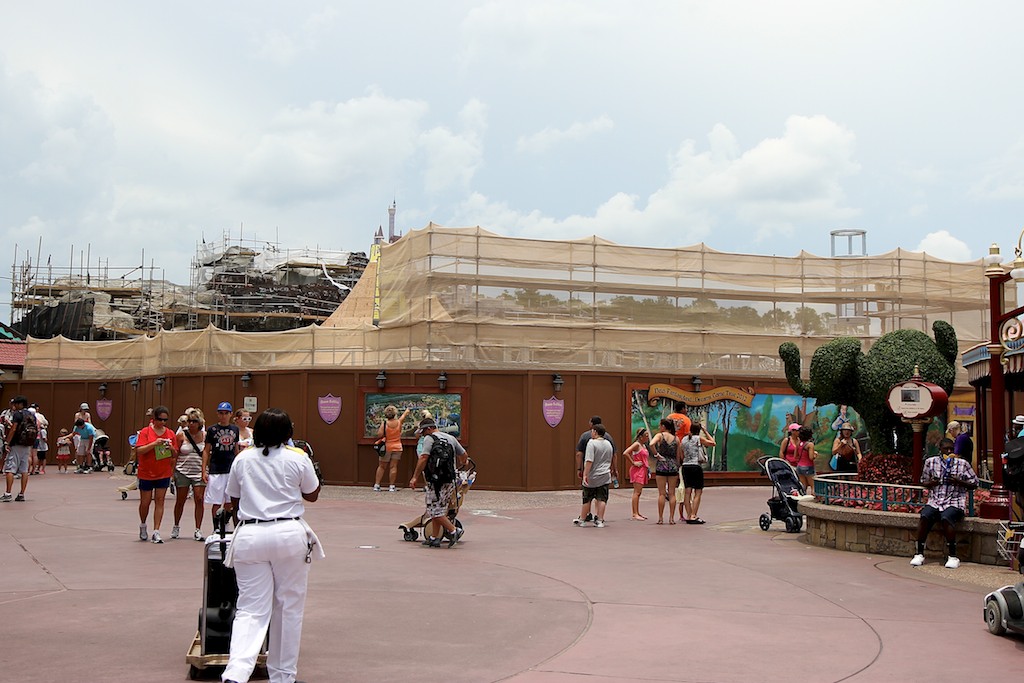 Fantasyland - The castle walls rise above the construction wall