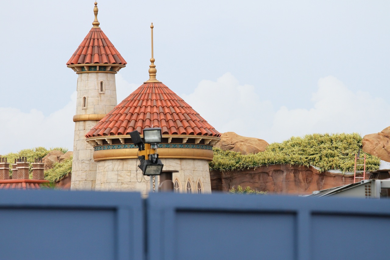 Fantasyland - Grass is being installed over the rockwork on the Mermaid building