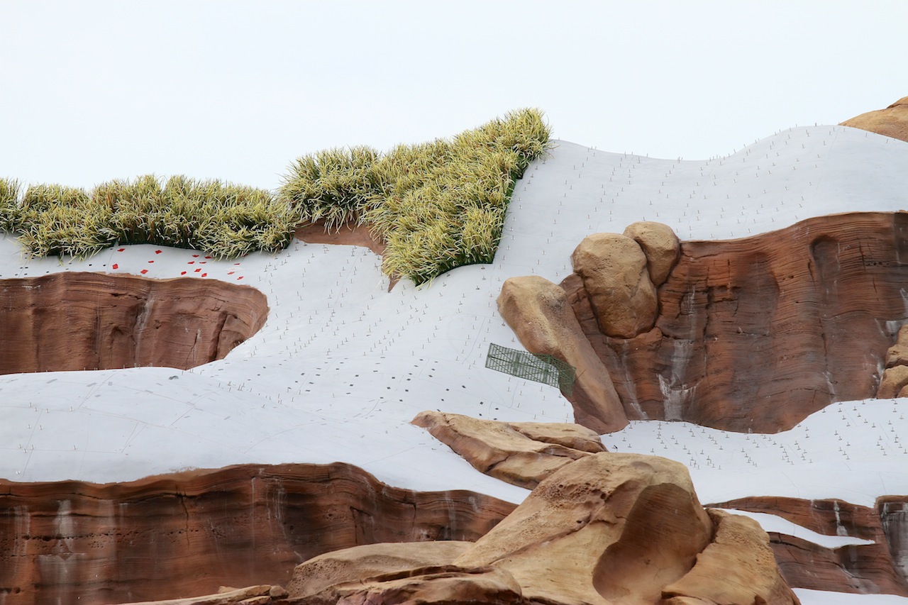 Fantasyland - Grass planting in-progress on the rockwork