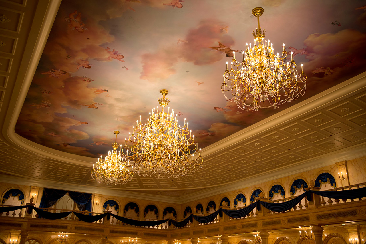 Fantasyland - Fairytale Elegance at Be Our Guest Restaurant – Decorated with a coffered, 20-foot ceiling with fluffy clouds and cherubs, the ballroom at Be Our Guest Restaurant features sparkling chandeliers designed to convey the elegance of the Beast’s Castle in “Beauty and the Beast.”