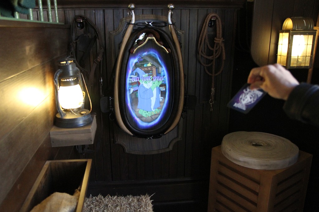 Sorcerers of the Magic Kingdom - The training area in the back of the room, which gives guests a chance to try using the cards