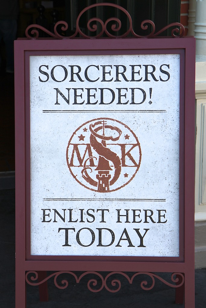 Sorcerers of the Magic Kingdom - Sorcerers Needed! signage infront of the Fire House